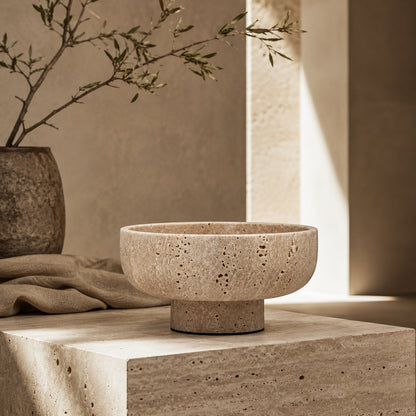 Terra Cream Travertine vessel in a styled setting
