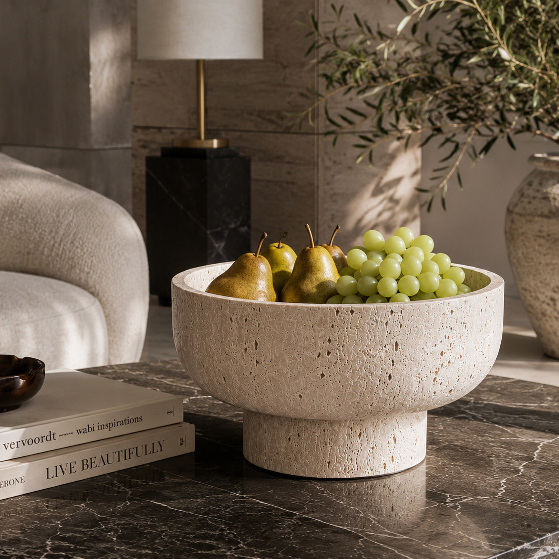 Terra Ivory Travertine fruit stand in a styled setting